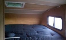 Cabover area after re-insulating, replacing paneling, and putting in the futon mattress.