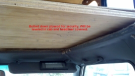 We replaced the previously removable section of the bed with bolted-down plywood to allow us to create a security divider between cab and camper.