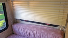 Hideous pink cushions and awful/non-insulated blinds