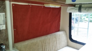 New insulated curtains that roll up and snap on using industrial snaps (detail photo below), and new cushions (new high density foam and new upholstery)