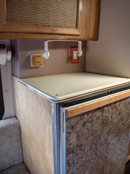 Details -- refrigerator, paper towel dispenser, thermostat and outlet